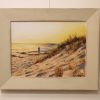 A framed oil painting depicting the late afternoon sun on a beach in Perth Western Australia