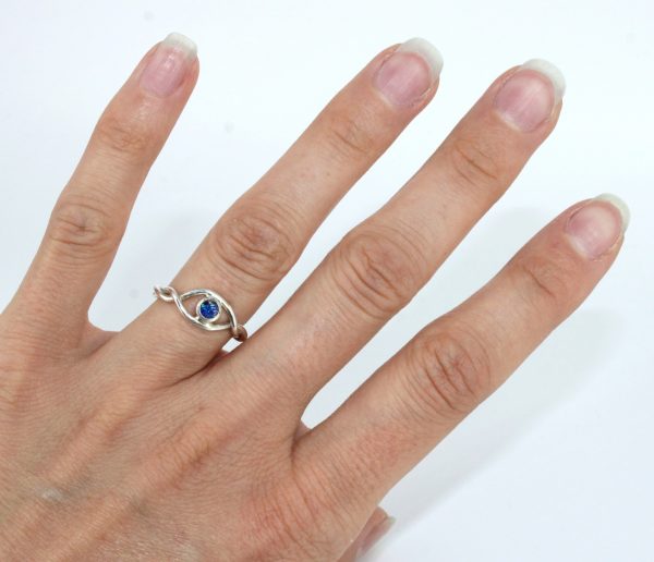 A handmade silver ring by REM Jewellery with an opel inset